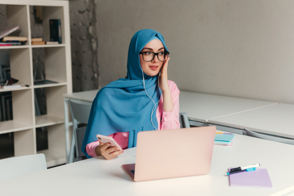 modern muslim woman in hijab in office room